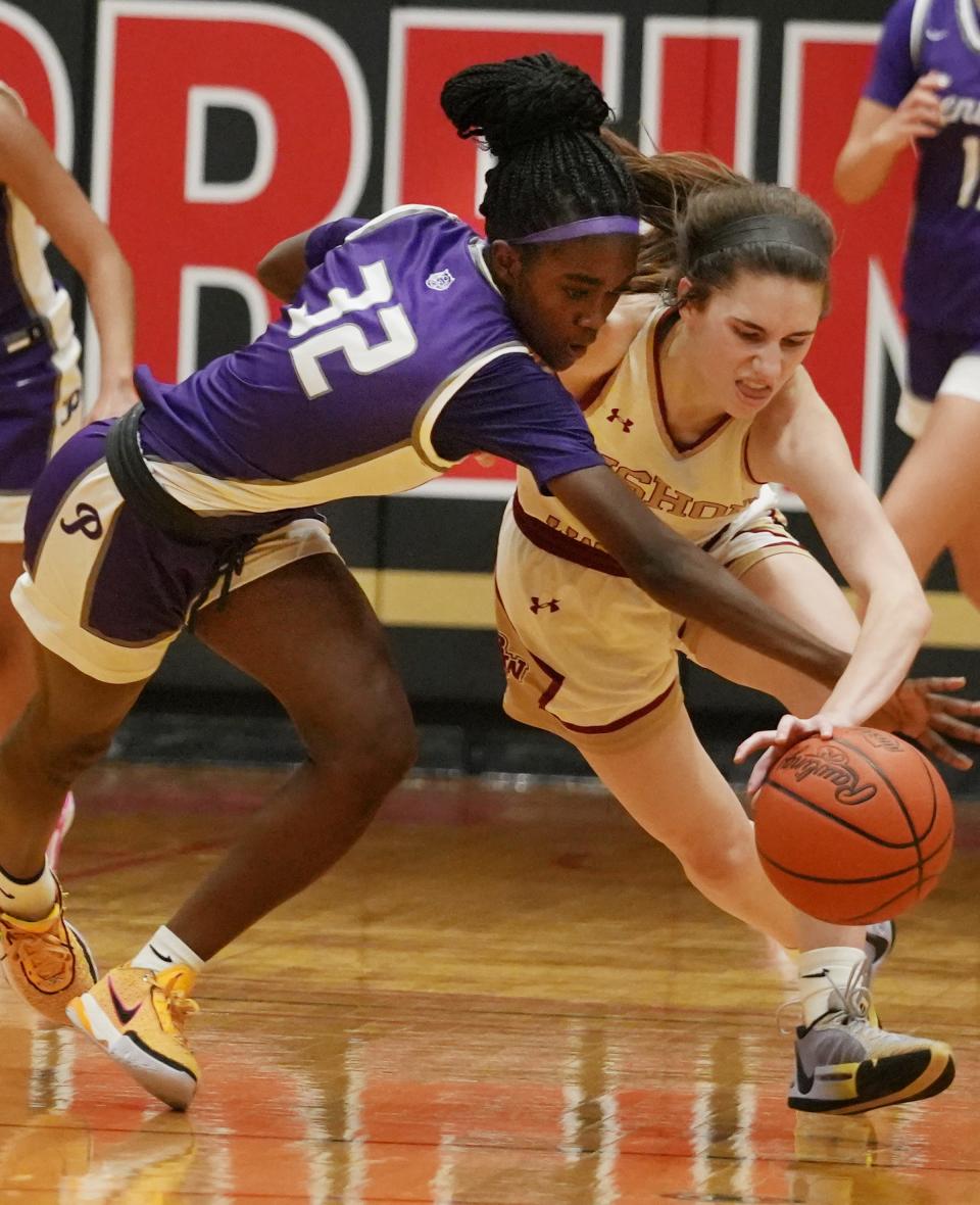 Pickerington Central's Faith King battles for the ball against Watterson's Sophie Ziel during the Division I regional final Friday at Otterbein.