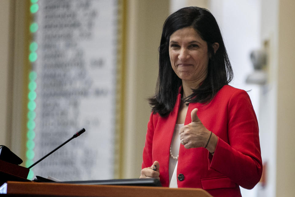 House speaker Sara Gideon, D-Freeport, flashes a thumbs up at a Democratic colleague prior to the start of the first session of the new year, Wednesday, Jan. 8, 2020, at the State House House in Augusta, Maine. (AP Photo/Robert F. Bukaty)