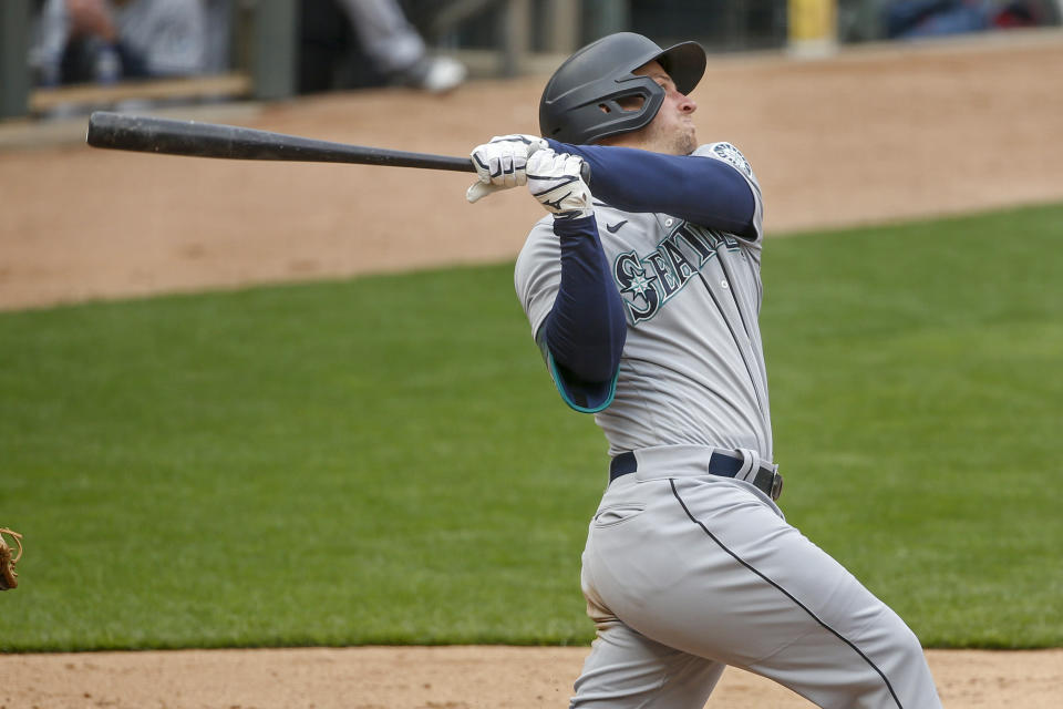 Seattle Mariners' Kyle Seager hits a three-run home run against the Minnesota Twins in the ninth inning of a baseball game Sunday, April 11, 2021, in Minneapolis. (AP Photo/Bruce Kluckhohn)