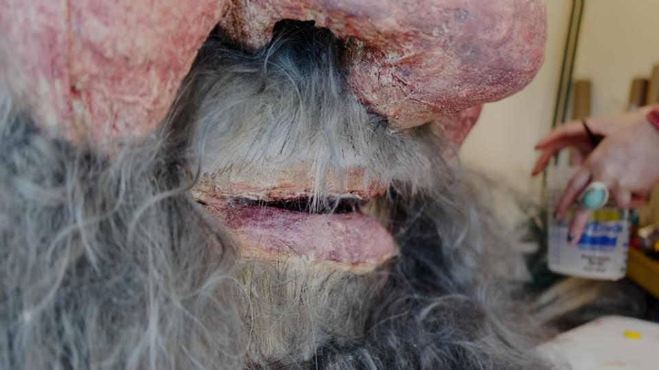 Beard of the puppet made out of wigs.