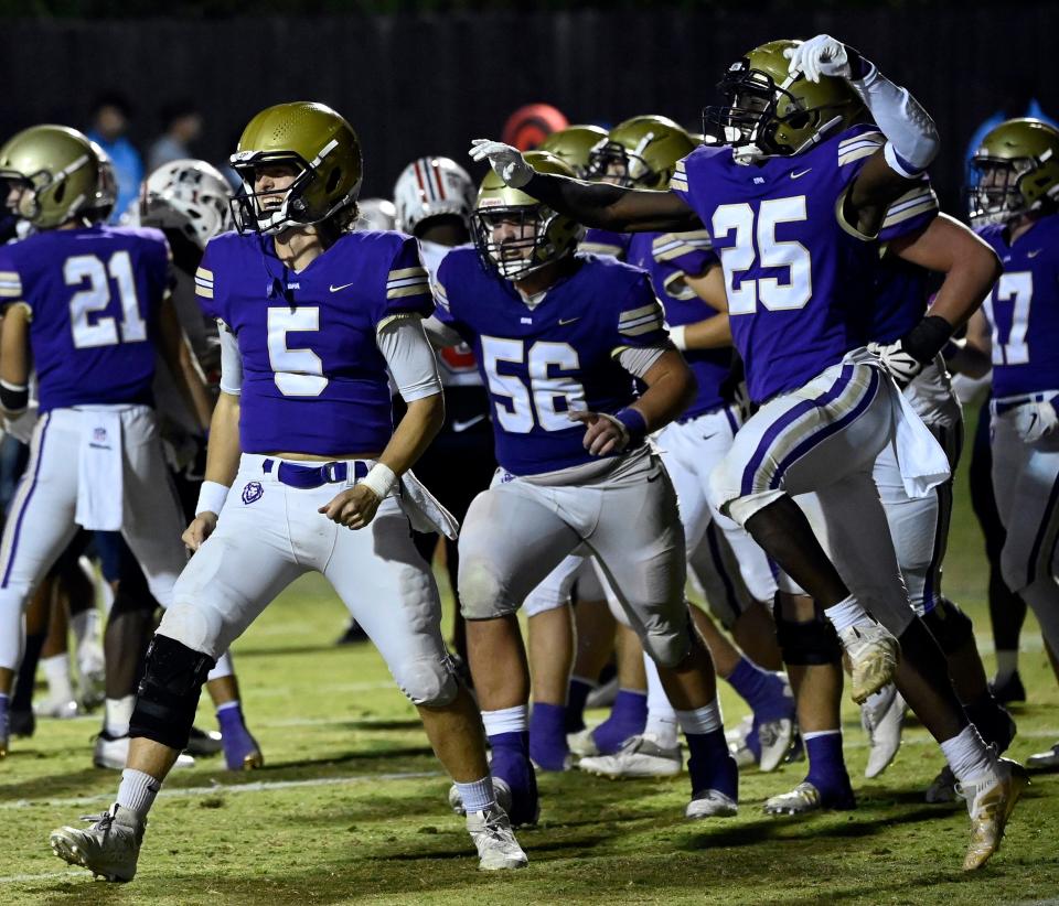 CPA’s Thomas Vaccaro (5) and Asher Keck (25) celebrate after the team’s 35-14 win against Oakland in an high school football game on Thursday, Oct. 6, 2022, in Nashville, Tenn. 