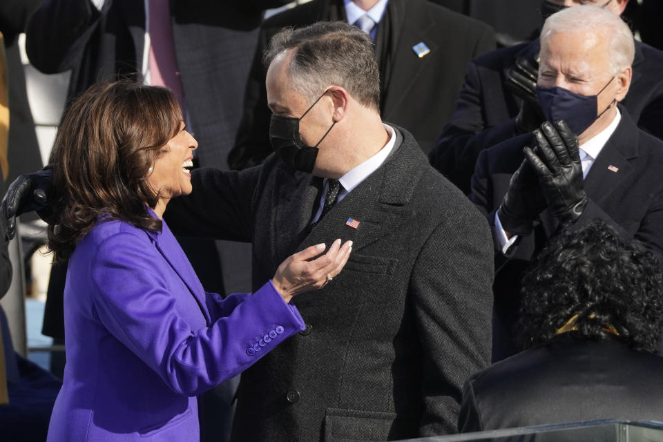 Vice President Kamala Harris hugs her husband Doug Emhoff after being sworn in as vice president by Supreme Court Justice Sonia Sotomayor during the 59th Presidential Inauguration at the U.S. Capitol in Washington, Wednesday, Jan. 20, 2021. (AP Photo/Andrew Harnik)