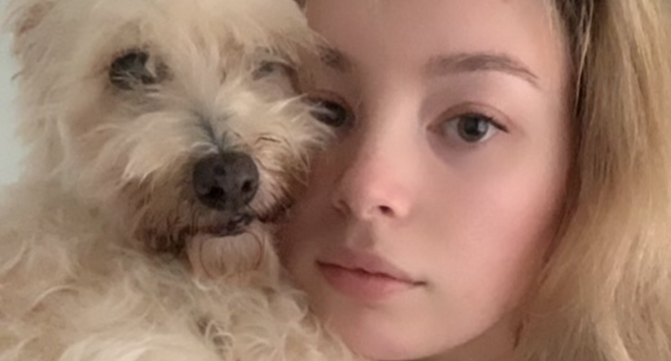 Anna Rowe is pictured with her pet dog. 