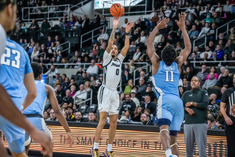 The Friars' Alyn Breed lets fly one of his five 3-pointers during Saturday's game against the Lions.