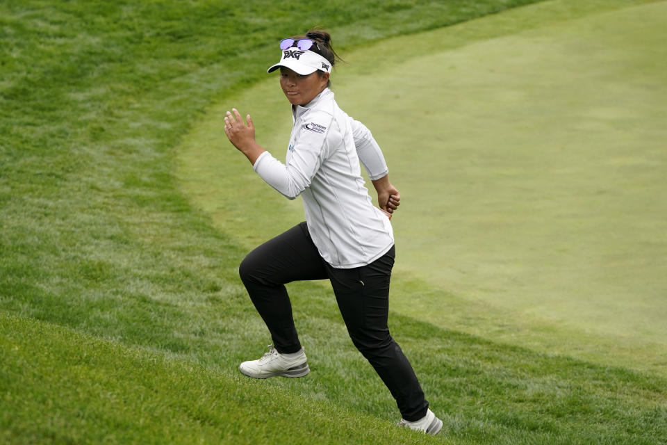 Megan Khang runs off the 18th green after finishing the second round of the U.S. Women's Open golf tournament at The Olympic Club, Friday, June 4, 2021, in San Francisco. (AP Photo/Jeff Chiu)