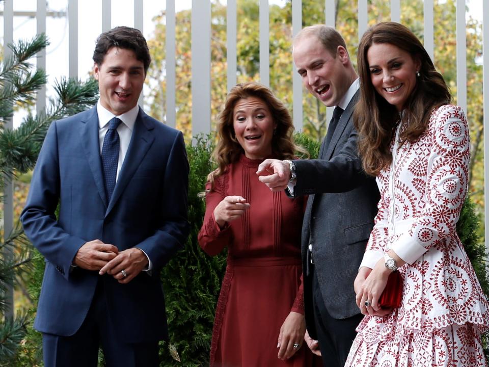 Canada's Prime Minister Justin Trudeau, his wife Sophie Gregoire Trudeau, Britain's Prince William and Catherine, Duchess of Cambridge, react while watching children play during a visit to the Immigrant Services Society in Vancouver, British Columbia, Canada, September 25, 2016.