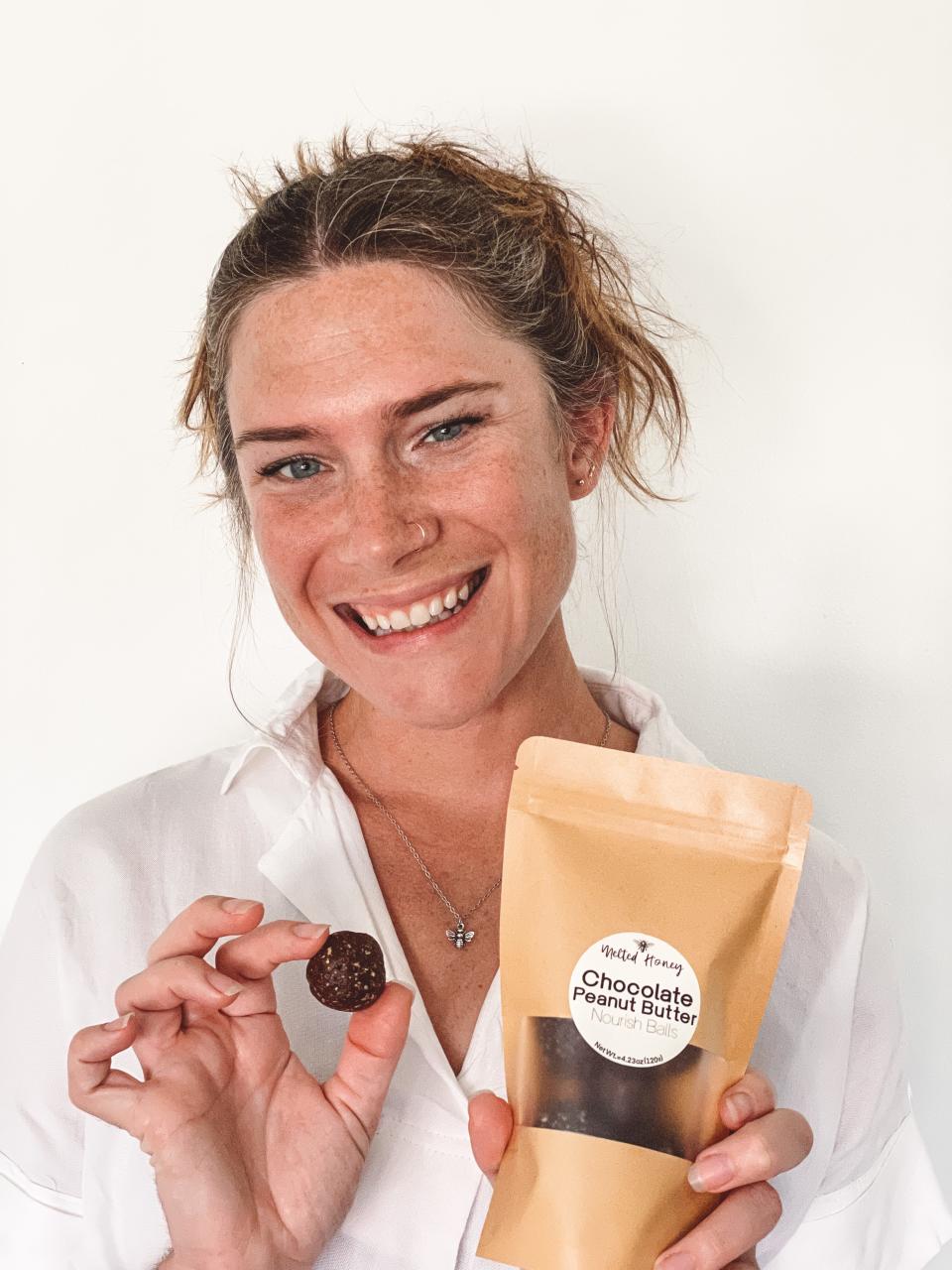 Jessica Tharp is the owner of Melted Honey, a new healthy food concept in Bay County that provides flavors of nourish balls with homemade ingredients. Tharp is shown holding the chocolate peanut butter balls.