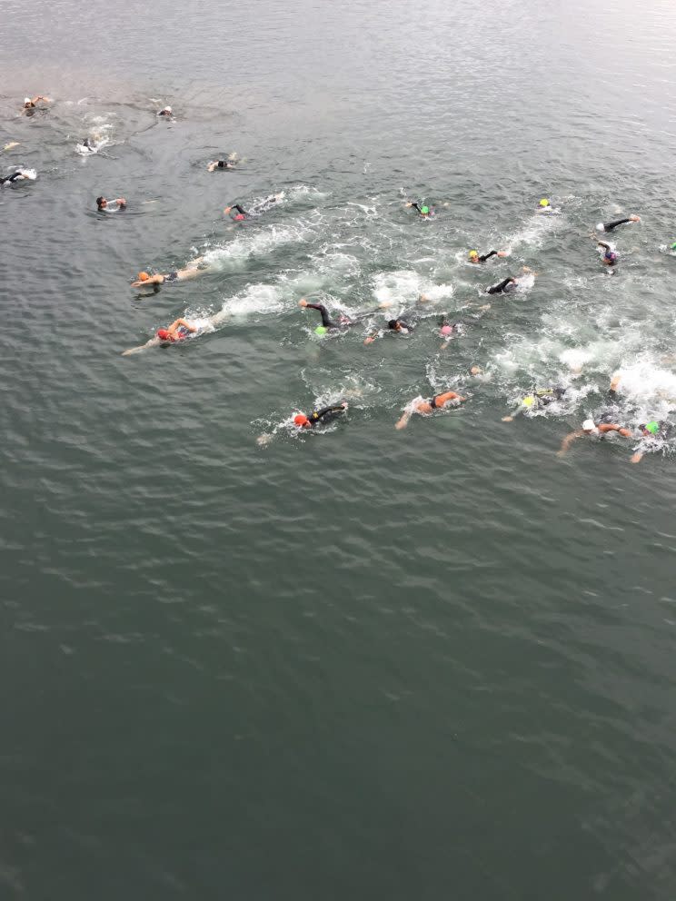 Athletes race out during the swim portion of a triathlon in Southern California (Anna Klein)