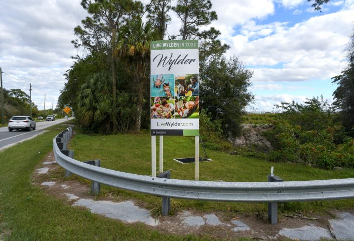 A sign for the new Wylder residential community is seen in the 10500 block of Midway Road, just west of Interstate 95, on Wednesday, Jan. 19, 2022, in St. Lucie County. The new community will include 3,400 home sites and 600 multi-family units. 