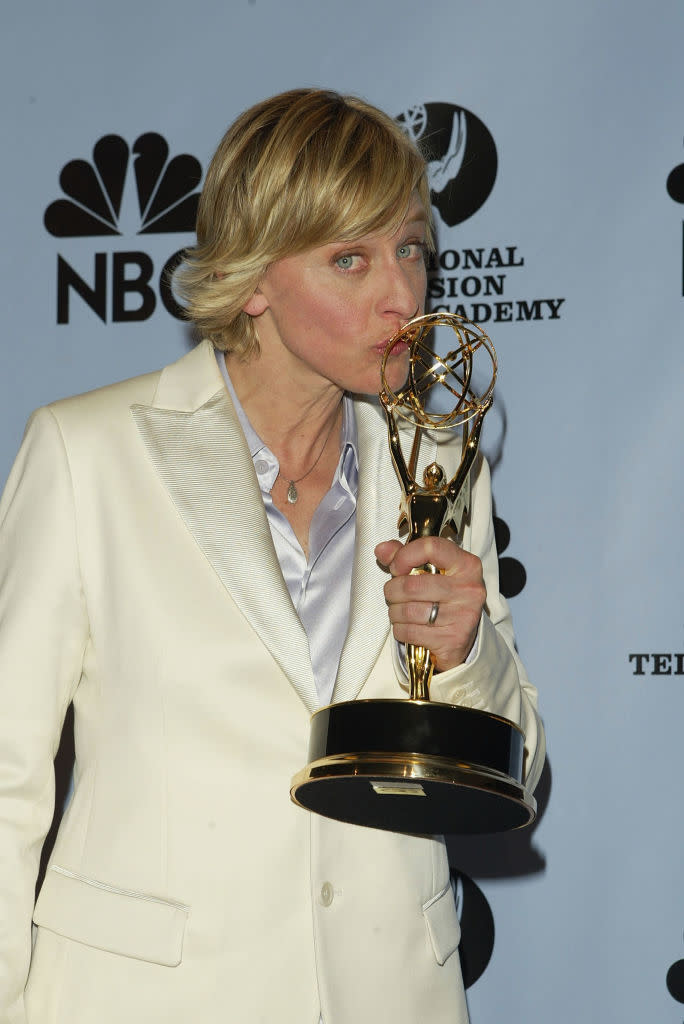 Ellen DeGeneres holds up an award for her talk show at the 31st Annual Daytime Emmy Awards on May 21, 2004. (Photo: Peter Kramer/Getty Images)

