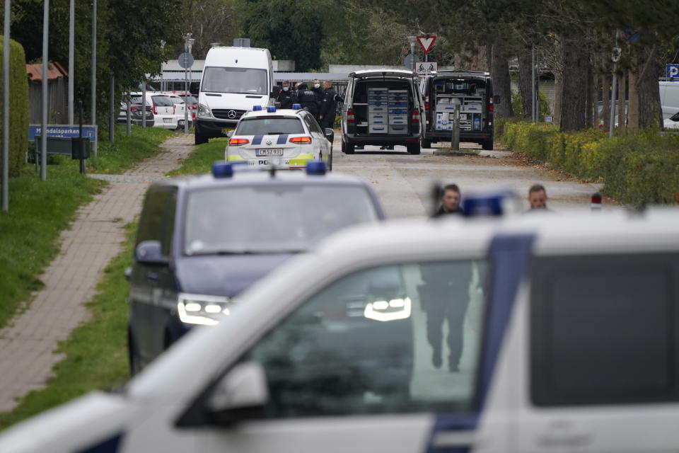 Police officers attend the scene after Peter Madsen was apprehended following a failed escape attempt in Albertslund, Denmark, Tuesday Oct. 20, 2020. The self-taught Danish engineer, who was convicted of torturing and murdering a Swedish journalist on his homemade submarine in 2017 before dismembering her body and dumping it at sea, on Tuesday was captured after attempted prison escape outside the suburban Copenhagen jail where he is serving life-time sentence. (Mads Claus Rasmussen/Ritzau Scanpix via AP)