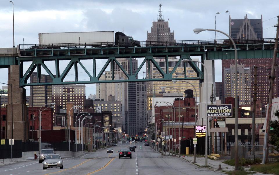 Commercial trucks travel over the land portion of the Ambassador Bridge to Windsor, Ontario over Jefferson avenue in Detroit, Michigan