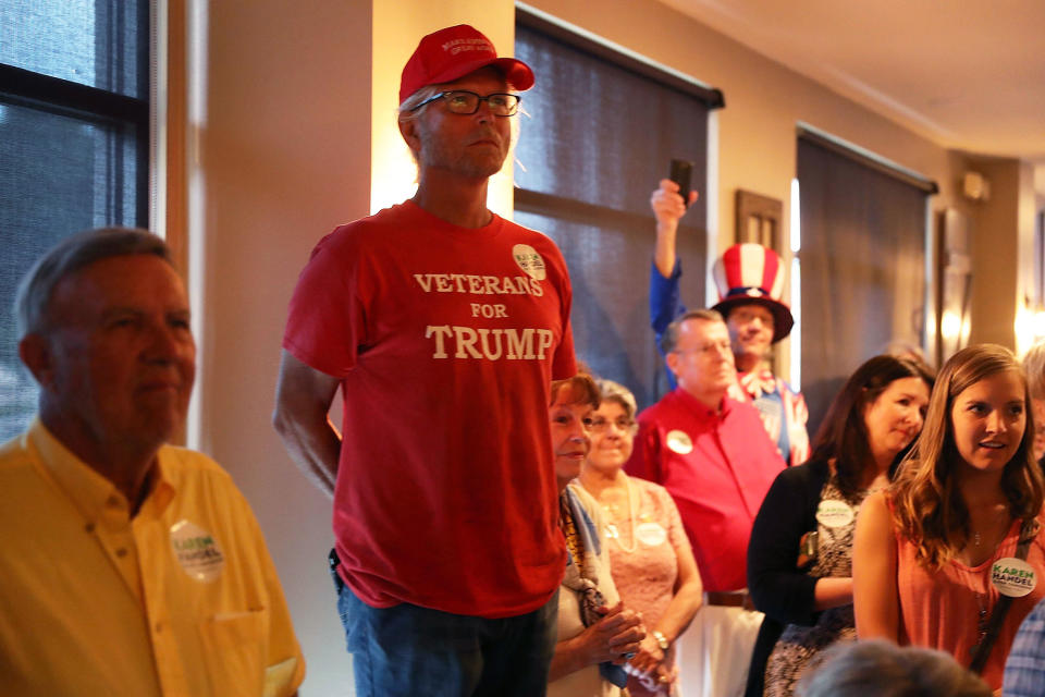 A Trump supporter listens to Karen Handel