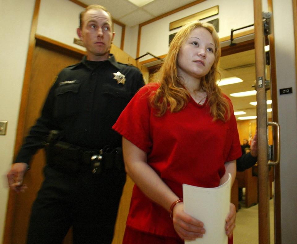 In this Kitsap Sun file photo from Oct. 27, 2005, Raven M. Hudson, 21, leaves the courtroom in the Kitsap County Courthouse in Port Orchard after being arraigned on a charge of first-degree murder for Janet Eaton's death.