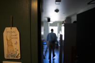 Cheyenne Welbourne stands in his micro-apartment at The Starlight affordable housing building that is run by Central City Concern, a Portland-based homeless services nonprofit, on Friday, March 15, 2024, in Portland, Ore. Welbourne moved into one of the nonprofit's single room occupancy units in downtown Portland last March after years of living on the streets. (AP Photo/Jenny Kane)