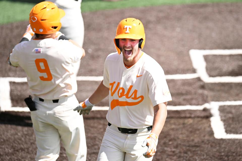 KNOXVILLE, TENNESSEE - MARCH 26: Blake Burke #25 of the Tennessee Volunteers celebrates after crossing home plate against the Texas A&M Aggies in the fifth inning at Lindsey Nelson Stadium on March 26, 2023 in Knoxville, Tennessee. (Photo by Eakin Howard/Getty Images)