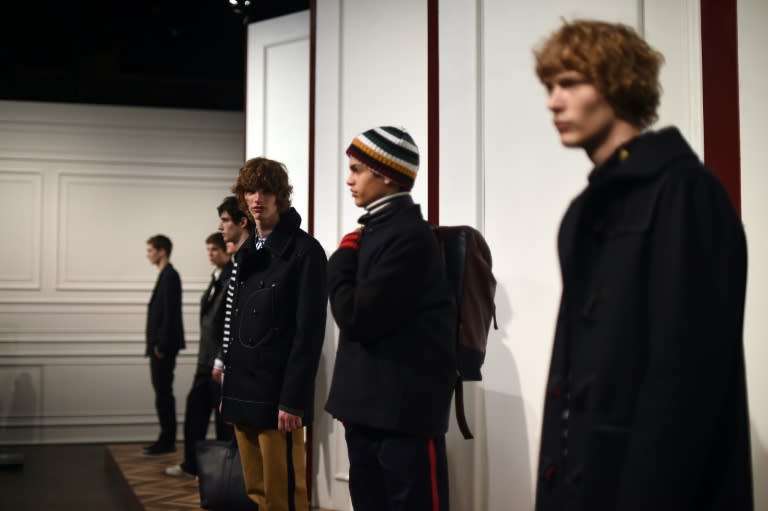 Models present creations by US designer Tommy Hilfiger during New York Men's Fashion Week, on February 3, 2016