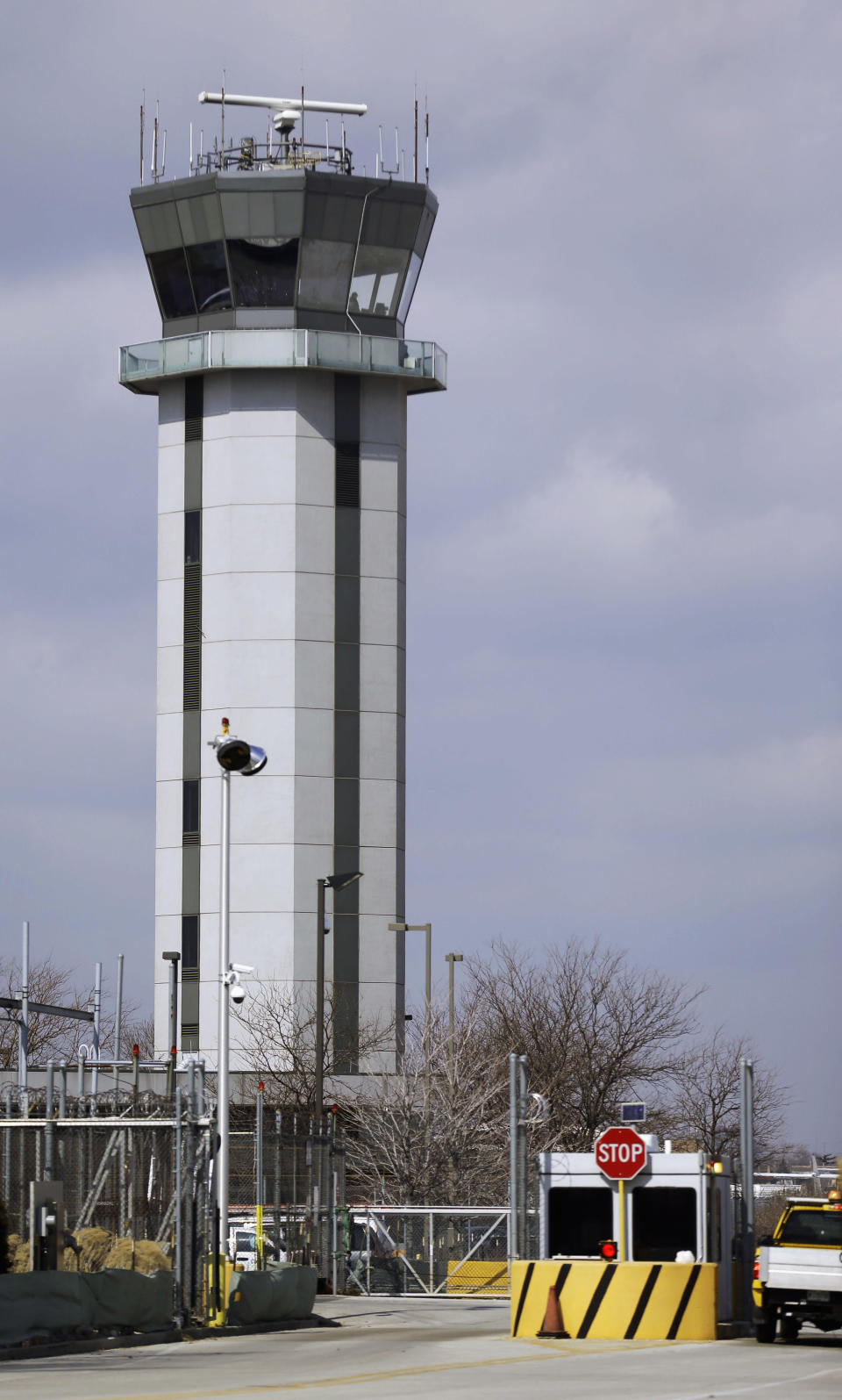 This March 12, 2013 photo shows the air traffic control tower at Chicago's Midway International Airport. Looming federal budget cuts could mean the closure of nearly 240 air traffic control towers at small airports across the country, stripping away an extra layer of safety during takeoffs and landings and leaving many pilots to manage the most critical stages of flight on their own. In addition, overnight shifts could be eliminated at 72 control facilities, including much larger airports such as Midway, which sees an average of 50 overnight flights, nearly all of them operated by Southwest and Delta. (AP Photo/M. Spencer Green)