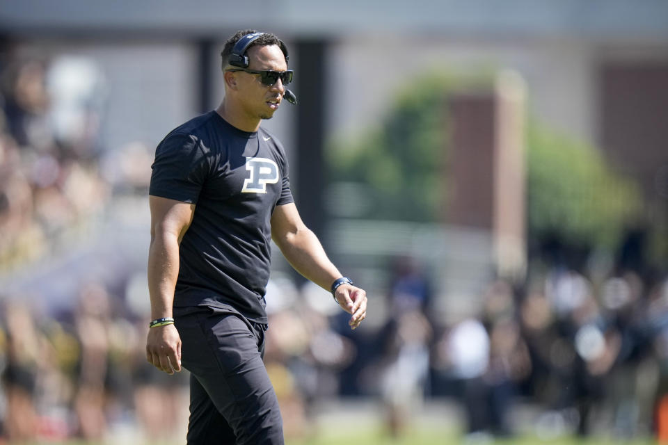 Purdue head coach Ryan Walters walks off the field after checking obn an injured player during the second half of an NCAA college football game against Fresno State in West Lafayette, Ind., Saturday, Sept. 2, 2023. Fresno State won 38-35. (AP Photo/AJ Mast)