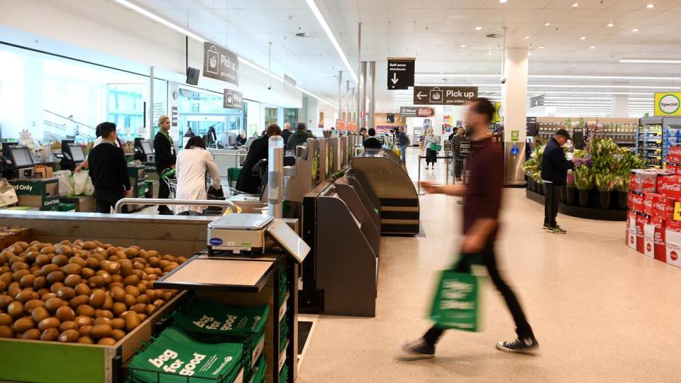 Woolworths staff at checkout (file image)