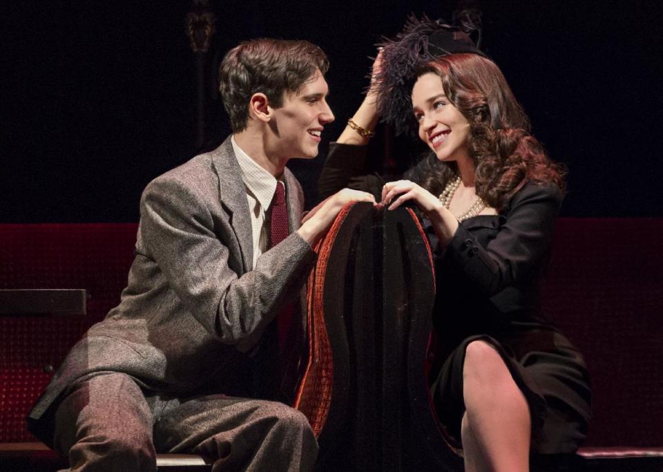 This theater image released by The O+M Company shows Cory Michael Smith, left, and Emilia Clarke in a scene from "Breakfast at Tiffany's," performing at the Cort Theatre in New York. (AP Photo/The O+M Company, Nathan Johnson Photography)