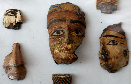 Ancient decorative faces on display at the newly discovered burial site, the Tomb of Tutu, at al-Dayabat, Sohag, Egypt April 5, 2019. REUTERS/Mohamed Abd El Ghany