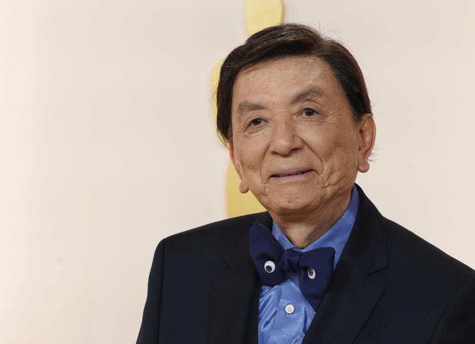 FILE - James Hong arrives at the Oscars on Sunday, March 12, 2023, at the Dolby Theatre in Los Angeles. Hong has a starring role in the new “Gremlins” animated prequel, “Secrets of the Mogwai,” and pops up in “American Born Chinese” on Disney+. (Photo by Jordan Strauss/Invision/AP, File)