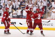 GLENDALE, AZ - APRIL 27: Mikkel Boedker #89 of the Phoenix Coyotes celebrates with Keith Yandle #3 and Shane Doan #19 after scoring a second period goal against the Nashville Predators in Game One of the Western Conference Semifinals during the 2012 NHL Stanley Cup Playoffs at Jobing.com Arena on April 27, 2012 in Glendale, Arizona. (Photo by Christian Petersen/Getty Images)