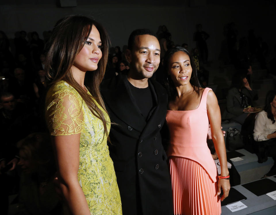 Model Chrissy Teigen, singer John Legend and actress Jada Pinkett Smith pose together before the Vera Wang Autumn/Winter 2013 collection during New York Fashion Week, February 12, 2013. REUTERS/Brendan McDermid (UNITED STATES - Tags: FASHION ENTERTAINMENT) - RTR3DP94