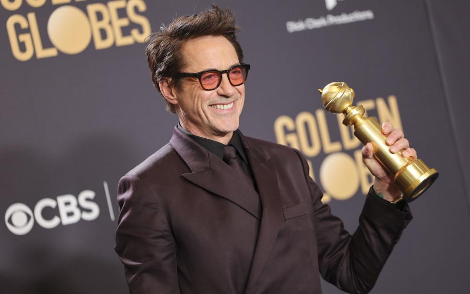 Robert Downey Jr with his Golden Globe for Oppenheimer