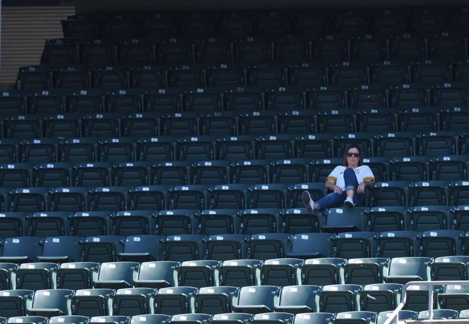 A lone fan in the stands.