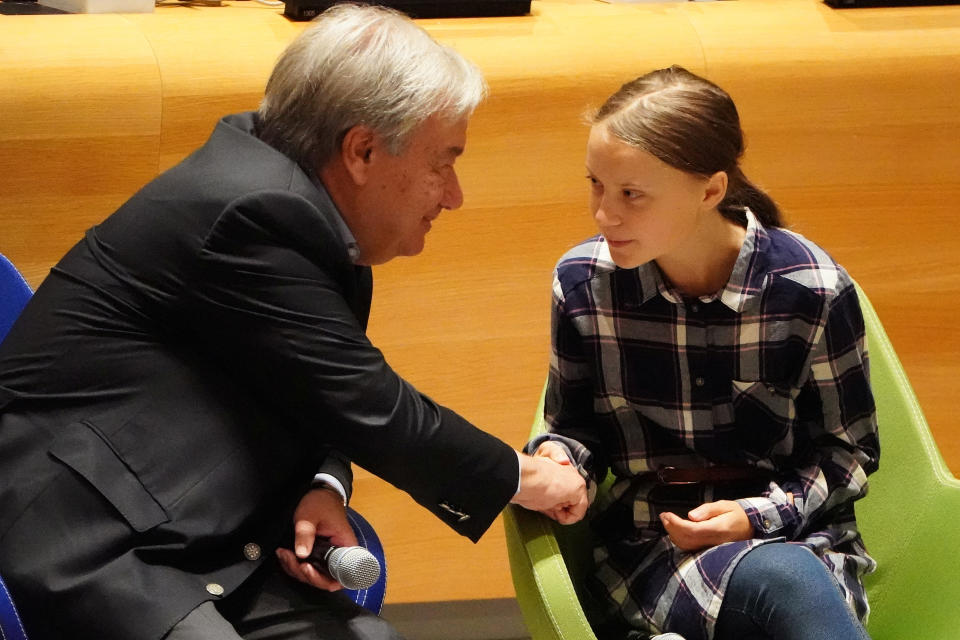 Secretary-General of the United Nations Antonio Guterres shakes hands with Swedish environmental activist Greta Thunberg at the Youth Climate Summit at United Nations Headquarters in the Manhattan borough of New York, New York, U.S., September 21, 2019. REUTERS/Carlo Allegri