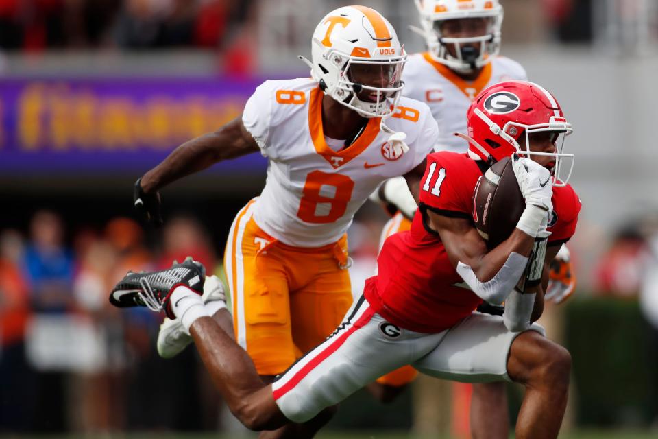 Georgia wide receiver Arian Smith (11) makes a catch during the first half of a NCAA college football game between Tennessee and Georgia in Athens, Ga., on Saturday, Nov. 5, 2022.