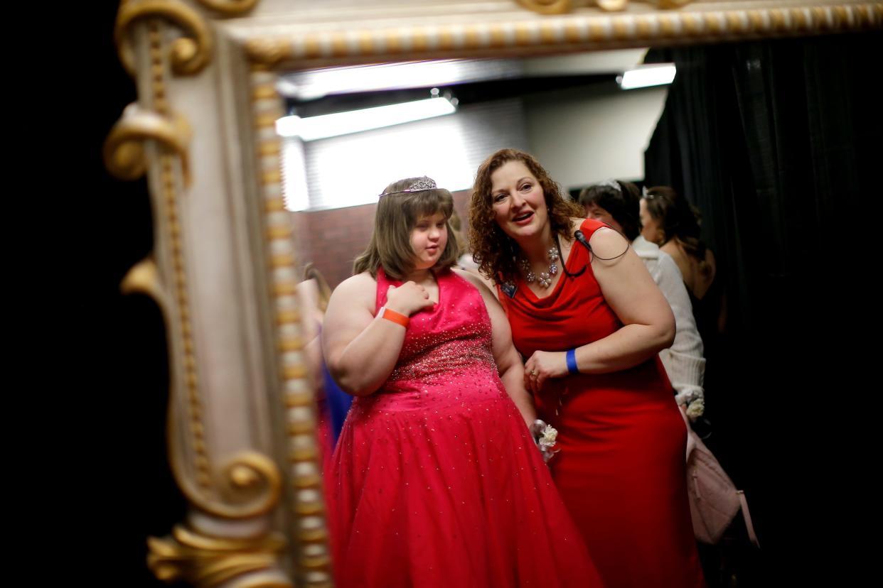 Madison Redman looks at her tiara in a mirror with volunteer Sherri Padgham before Redman walks the red carpet during the 2018 Oklahoma City "Night to Shine" prom experience co-sponsored by the Tim Tebow Foundation and the event site Putnam City Baptist Church. Photo by Bryan Terry, The Oklahoman