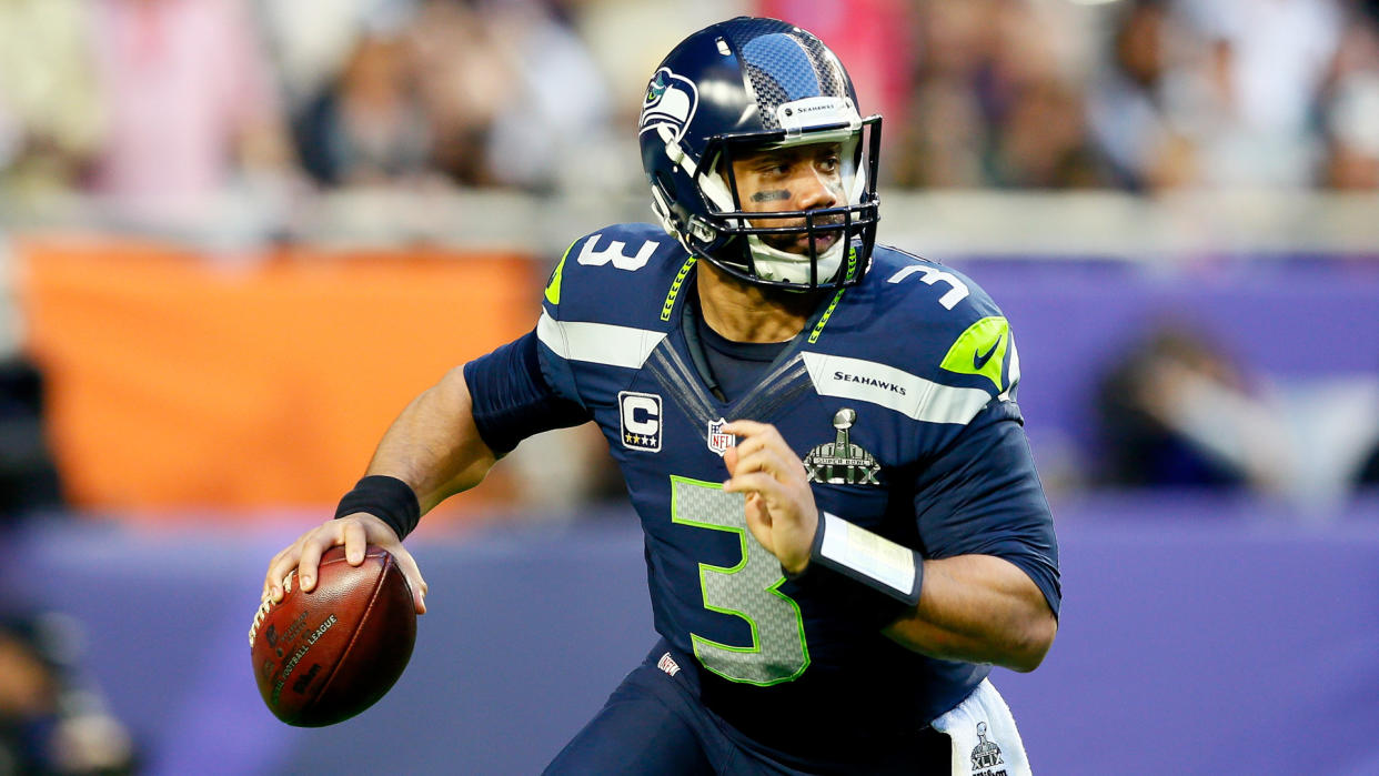 GLENDALE, AZ - FEBRUARY 01:  Russell Wilson #3 of the Seattle Seahawks looks to pass in the first quarter against the New England Patriots during Super Bowl XLIX at University of Phoenix Stadium on February 1, 2015 in Glendale, Arizona.