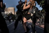 Riot police clear Lafayette Park for a photo opportunity by President Donald Trump in Washington