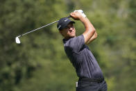 Cameron Champ hits from the 12th tee during the first round of the BMW Championship golf tournament, Thursday, Aug. 27, 2020, at Olympia Fields Country Club in Olympia Fields, Ill. (AP Photo/Charles Rex Arbogast)