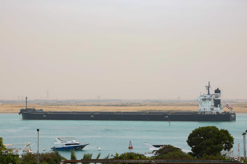 The YM Navigator bulk carrier vessel moves along the Suez Canal towards Ismailia in Suez, Egypt, on Dec. 21, 2023.  / Credit: Stringer/Bloomberg via Getty Images
