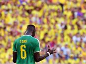 <p>Salif Sane reacts after Senegal were knocked out of the World Cup on yellow cards </p>