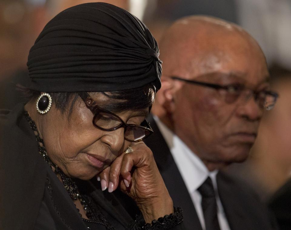 <p>Winnie Madikizela-Mandela, left, Nelson Mandela’s former wife, and South African President Jacob Zuma attend a memorial service for Mandela at the Bryanston Methodist Church near Johannesburg, South Africa, on Dec. 8, 2013. (Photo: Peter Dejong/AP) </p>