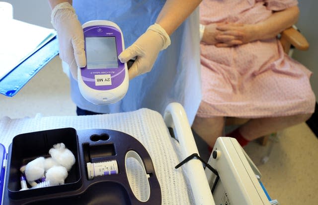 A nurse gives a patient a diabetes test at the Royal Liverpool University Hospital, Liverpool 