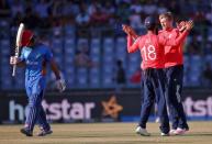 Cricket - England v Afghanistan - World Twenty20 cricket tournament - New Delhi, India, 23/03/2016. England's David Willey (R) celebrates with his teammate Moeen Ali after taking the wicket of Afghanistan's Gulbadin Naib. REUTERS/Adnan Abidi