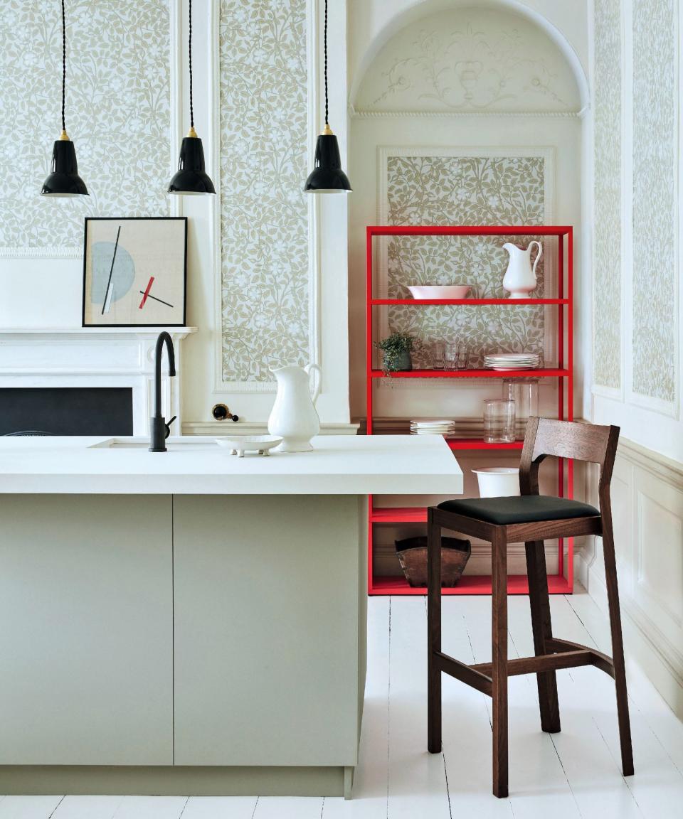 White and green kitchen with mural in green leaves with panels