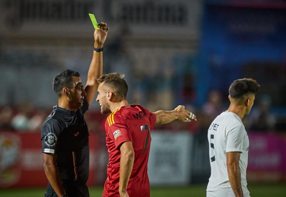 Jun 4, 2022; Chandler, AZ, USA; The referee shows the yellow card to Phoenix Rising midfielder Santi Moar (7) at Phoenix Rising FC Stadium. Mandatory Credit: Alex Gould/The Republic