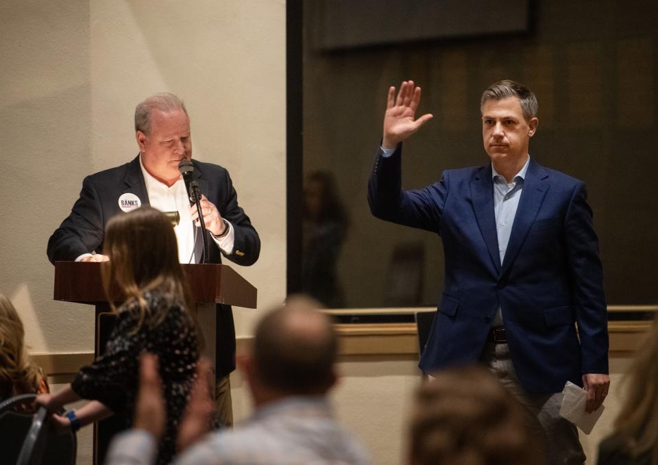 U.S. Rep. Larry Bucshon, left, introduces U.S. Rep. Jim Banks during the annual Posey County Republican Party's Lincoln Day Dinner at the New Harmony Resort & Conference Center in New Harmony, Ind., Thursday night, April 6, 2023. Banks is running for the U.S. Senate.