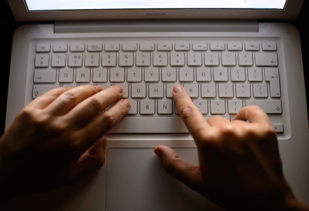 Generic stock photo shows a woman’s hands using a laptop keyboard (Dominic Lipinski/PA) (PA Archive)