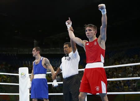 2016 Rio Olympics - Boxing - Preliminary - Men's Bantam (56kg) Round of 16 Bout 177 - Riocentro - Pavilion 6 - Rio de Janeiro, Brazil - 14/08/2016. Michael Conlan (IRL) of Ireland celebrates after winning his bout against Aram Avagyan (ARM) of Armenia. REUTERS/Peter Cziborra