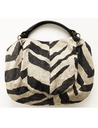 On a canvas tote, a striking zebra print is very safari meets city. Full of pockets, the roomy shape is big enough for all your essentials.