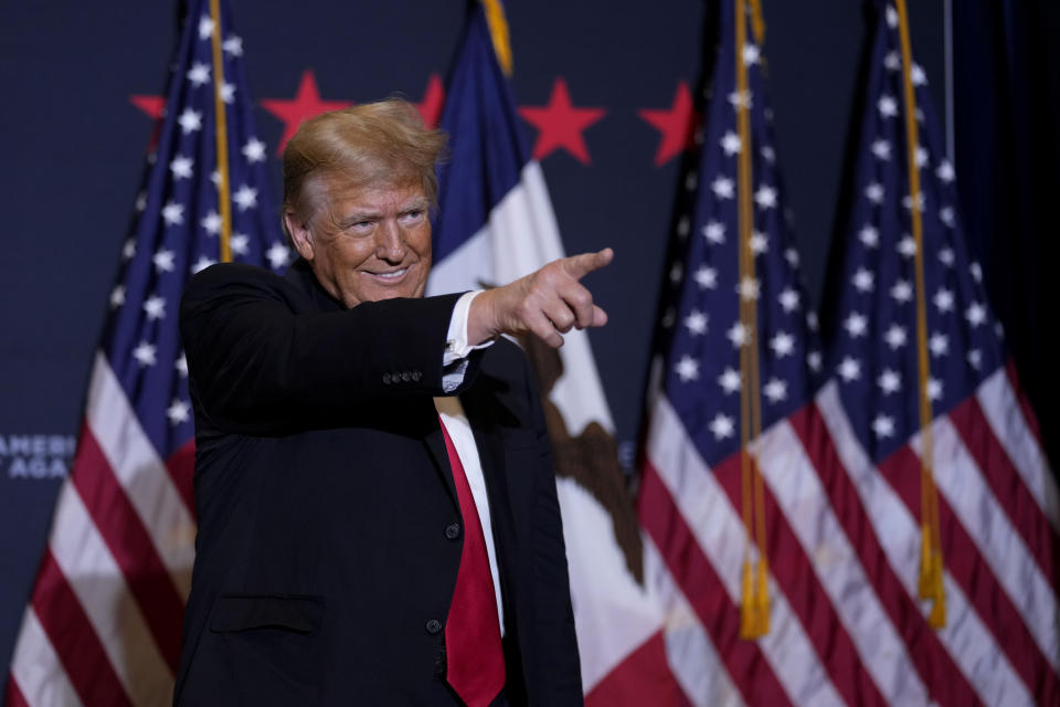 Former President Donald Trump arrives at a commit to caucus rally, Wednesday, Dec. 13, 2023, in Coralville, Iowa. (AP Photo/Charlie Neibergall)