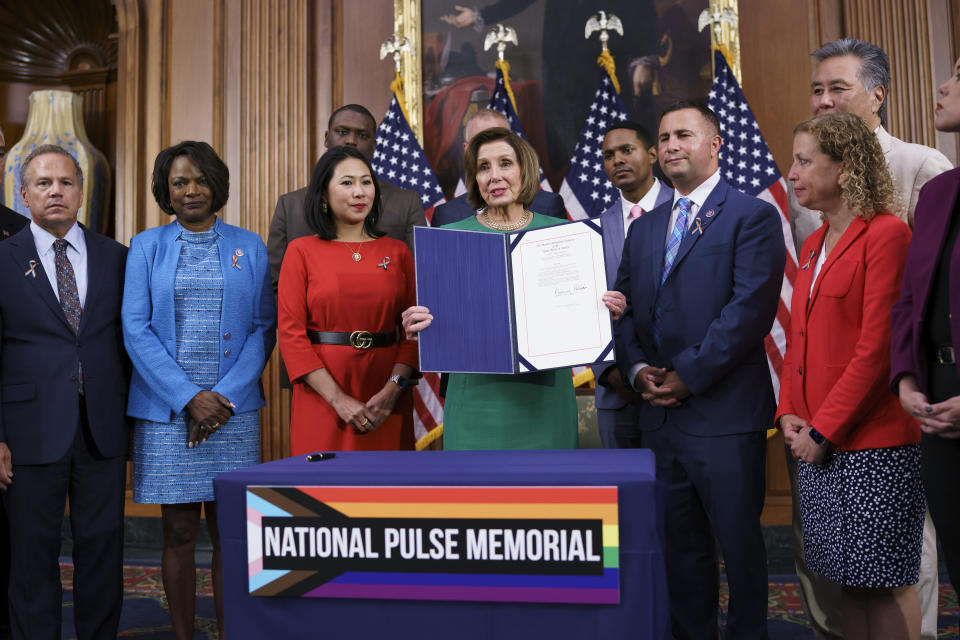 House Speaker Nancy Pelosi, D-Calif., is joined by members after signing a bill to create the National Pulse Memorial to honor the victims of the 2016 mass shooting at the Pulse nightclub in Orlando, at the Capitol in Washington, Wednesday, June 16, 2021. From left are Rep. David Cicilline, D-R.I., Rep. Val Demings, D-Fla., Rep. Stephanie Murphy, D-Fla., Speaker Pelosi, Rep. Darren Soto, D-Fla., and Rep. Debbie Wasserman Schultz, D-Fla. It was the deadliest attack on the LGBTQ community in U.S. history, 49 people dead. (AP Photo/J. Scott Applewhite)